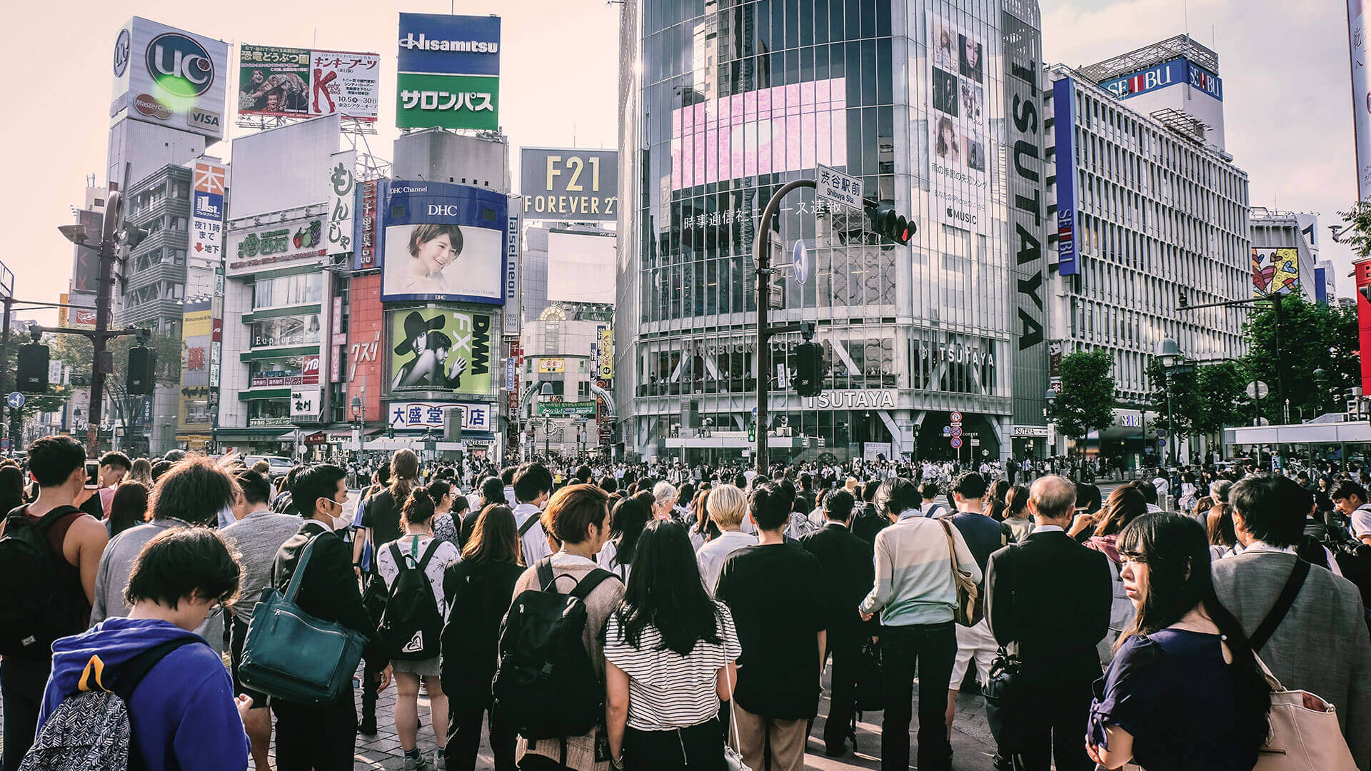 A busy crossroad in japan crowded with people.